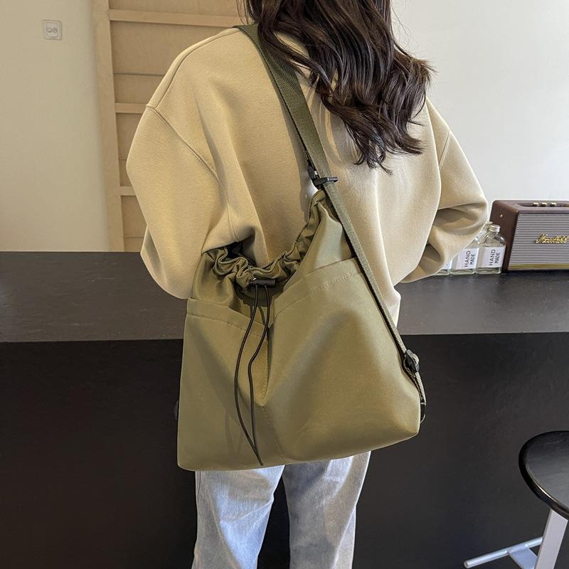 2024 New Japanese Solid Color One Shoulder Underarm Bag Folded Simple Drawstring Lightweight Casual Commuter Double Shoulder Bucket Bag