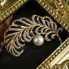 Gold-Plated Feather Brooch with Zircon and Pearl Detailing