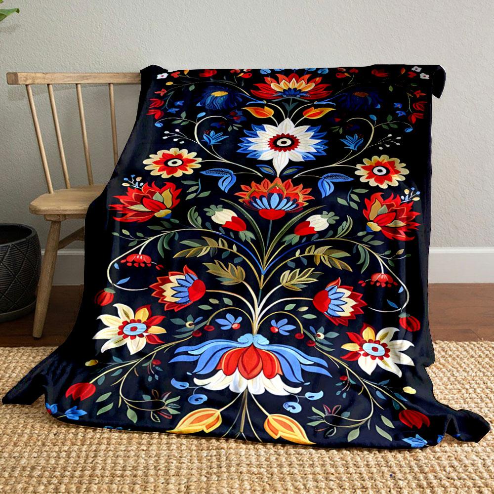 Bright floral motifs with symmetrical stems and vibrant colors on black. for all seasons blanket lunch break throw gift