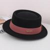 Autumn and winter French flat-brimmed woolen flat-top top top hat female British show small face simple temperament elegant celebrity style jazz hat