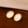 Natural white fritillary black agate oval stud earrings women's antique light luxury temperament earrings S silver needle earrings