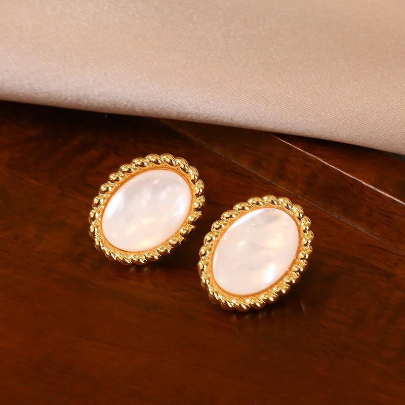 Natural white fritillary black agate oval stud earrings women's antique light luxury temperament earrings S silver needle earrings