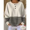 Women's Three-Button Henley Collar Waffle Long-Sleeve Top, Featuring a Contrasting Stripe Patchwork Design.