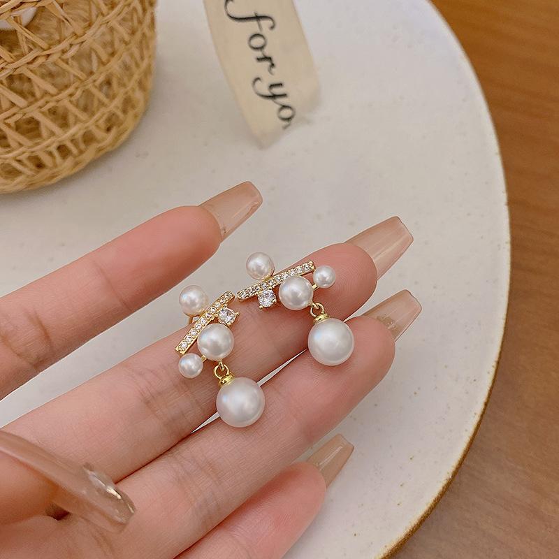 Silver needle micro-inlaid zircon pearl earrings women's light luxury high-end sense niche unique earrings Japanese and Korean style ear jewelry