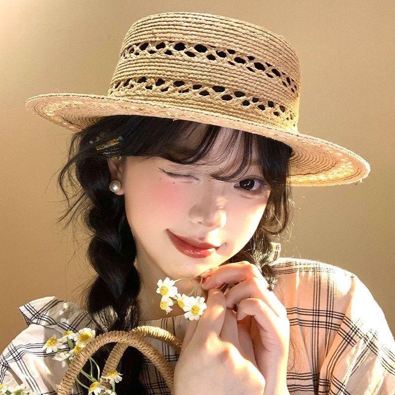 New hollow flat top Lafite straw hat women's summer new seaside beach sun hat French elegant straw top hat