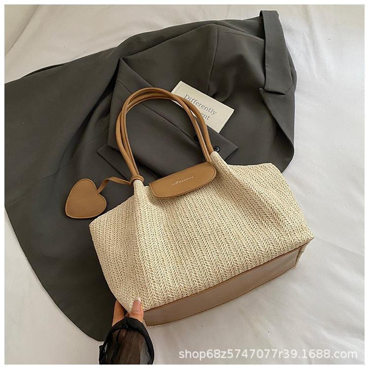 Straw bag women's 2025 new seaside woven handbag niche crossbody bag versatile tote bag is popular this year
