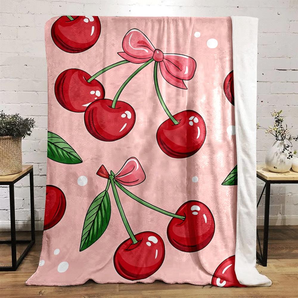 Red cherries with green stems and leaves, pink bows, on soft pink background. for all seasons blanket lunch break throw gift