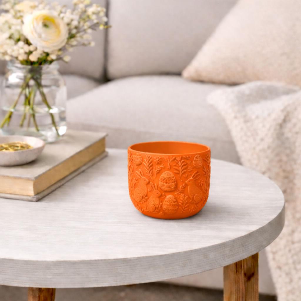 Orange Easter flowerpot with rabbits, decorative spring cover
