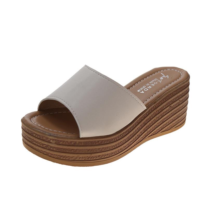 Slope heel cool slippers women's 2025 spring and summer new Korean version thick bottom one word beach women wear muffin bottom slippers