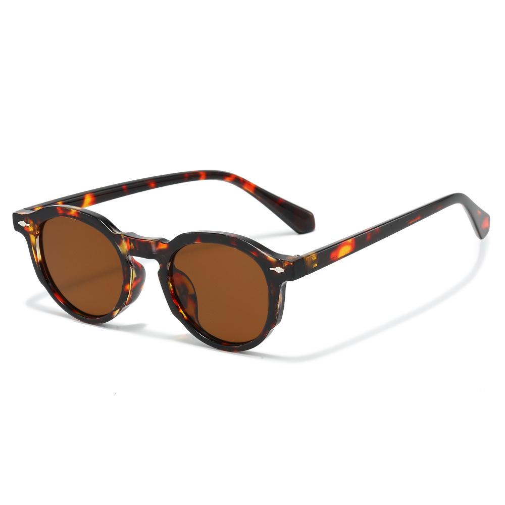 New round street fashion sunglasses, European and American retro simple metal tooth PC sunglasses
