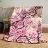 Pink cherry blossoms with brown branches and scattered petals on beige. for all seasons blanket lunch break throw gift