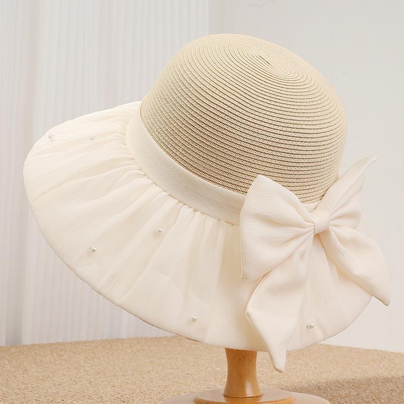 Spring and summer new women's straw hat big brim sun hat French pearl bow versatile sun protection hat travel