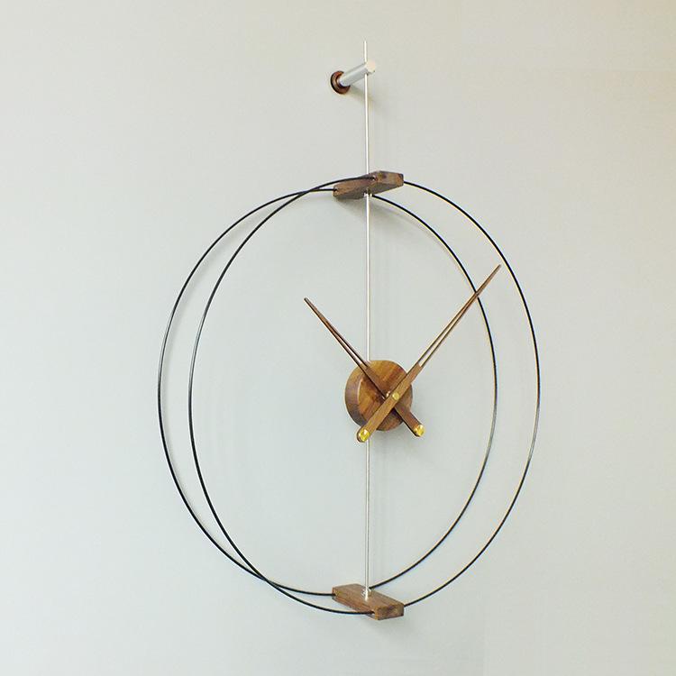 Nordic Modern Minimalist Spanish Nomon Wall Clock, Black Walnut with Large Copper Pointer for Hotel and Living Room Decor.