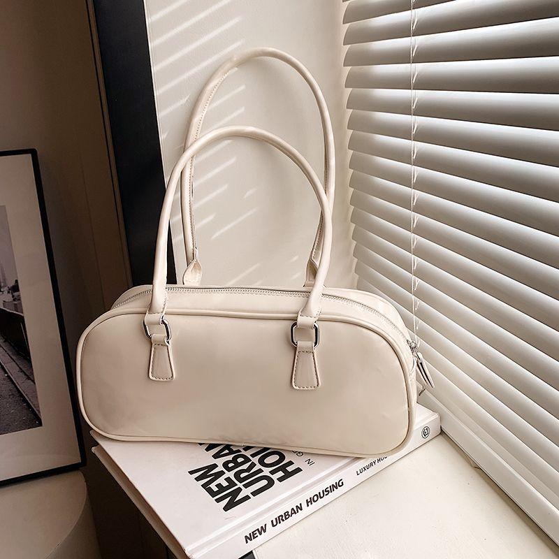 Korean version retro fashion versatile bag handbag new portable bowling shoulder bag commuter armpit bag