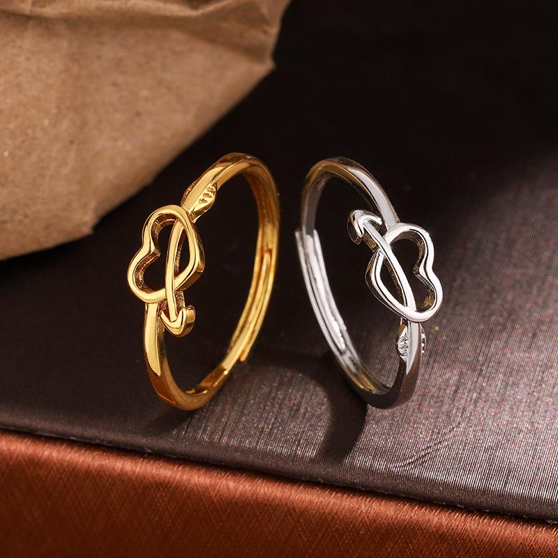 Exquisite New Year Style Hollow Heart Ring: Trendy Woman's Design with Arrow Through the Heart.