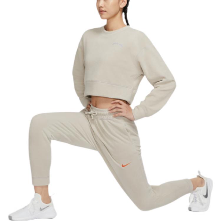 Nike Женские спортивные штаны из флиса с завязками и логотипом Therma-Fit, кремовые DO6969-236