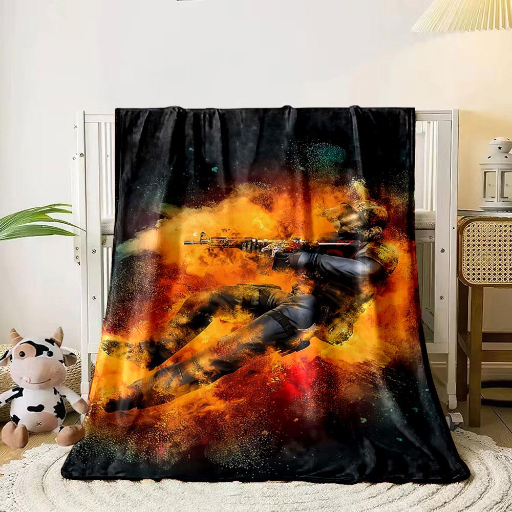 A soldier mid-action surrounded by fiery, explosive orange effects. for all seasons blanket lunch break throw gift
