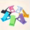 Adjustable Portable Phone Stand | Compact Folding Design, Durable Plastic Material, Multi-Color | Desk Accessory, Vibrant Design