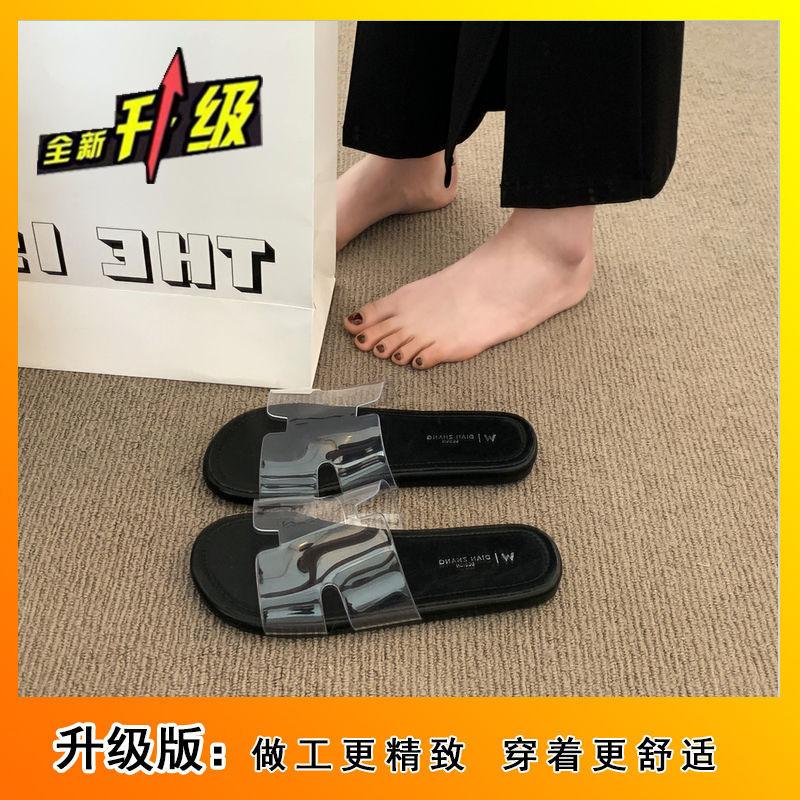2025 summer new fashion versatile beach vacation flat bottom drag French temperament flat bottom cool slippers transparent word belt