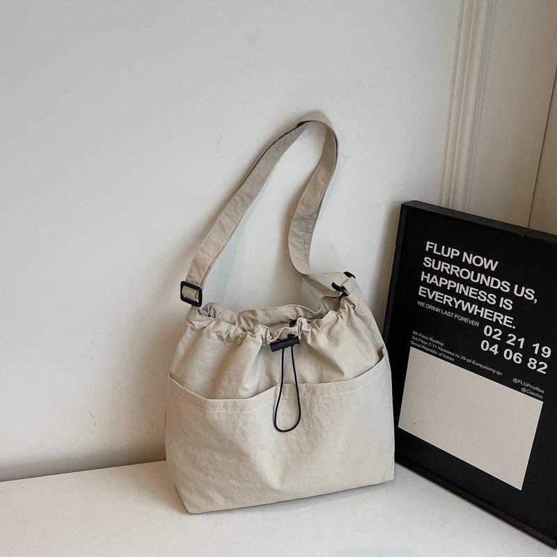 Новая летняя сумка-ведро большой вместимости с завязками на шнурке для женщин, японская повседневная сумка через плечо, уличная сумка для поездок на работу и обратно