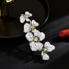 SUYU Женская брошь с элегантным дизайном в стиле легкой роскоши, с инкрустацией цирконами в виде цветка, модная и универсальная брошь с нишевым чувством дизайна