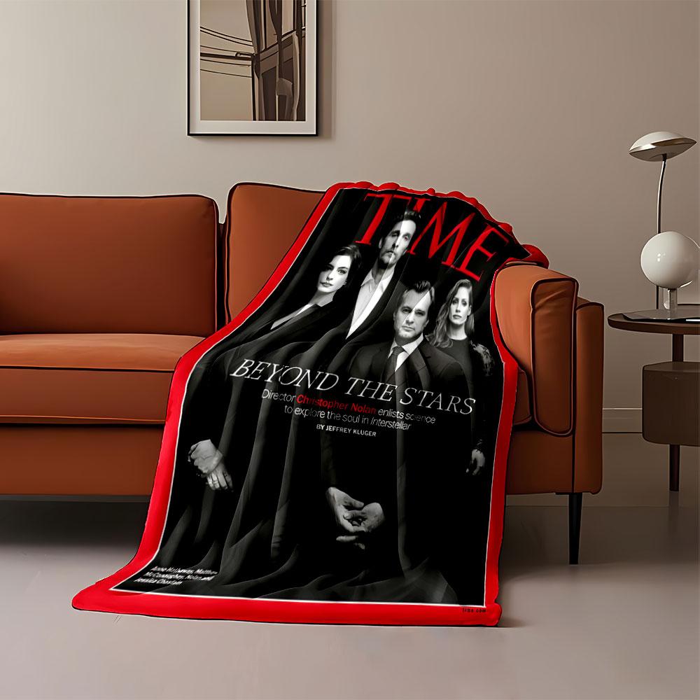 Black-clad group poses formally, surrounded by red border and text. for all seasons blanket lunch break throw gift