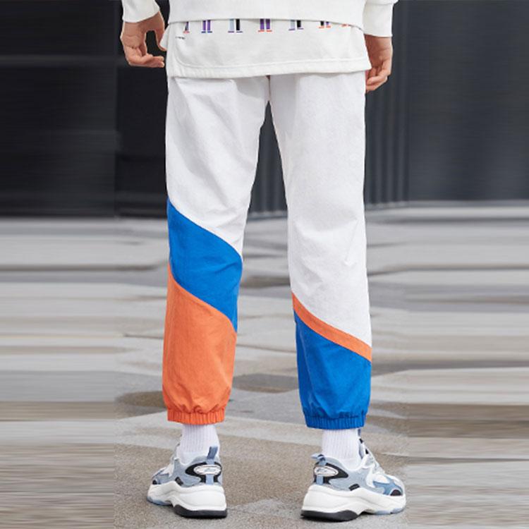 Li Ning Sports Fashion Series Logo Pattern Splicing Design Tapered Knit Pants Autumn Men Bottoms White AKXR421-3
