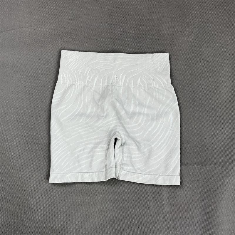 «Новый бесшовный европейский и американский фитнес-комплект: Топ с коротким рукавом, штаны для йоги, спортивный бюстгальтер для женщин.