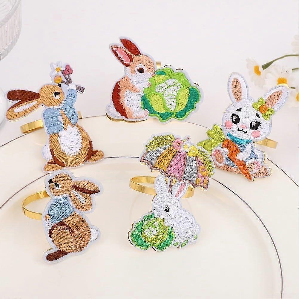 Set of 4 metal Easter bunny napkin rings with embroidered details for festive table decoration at home, hotel or party events