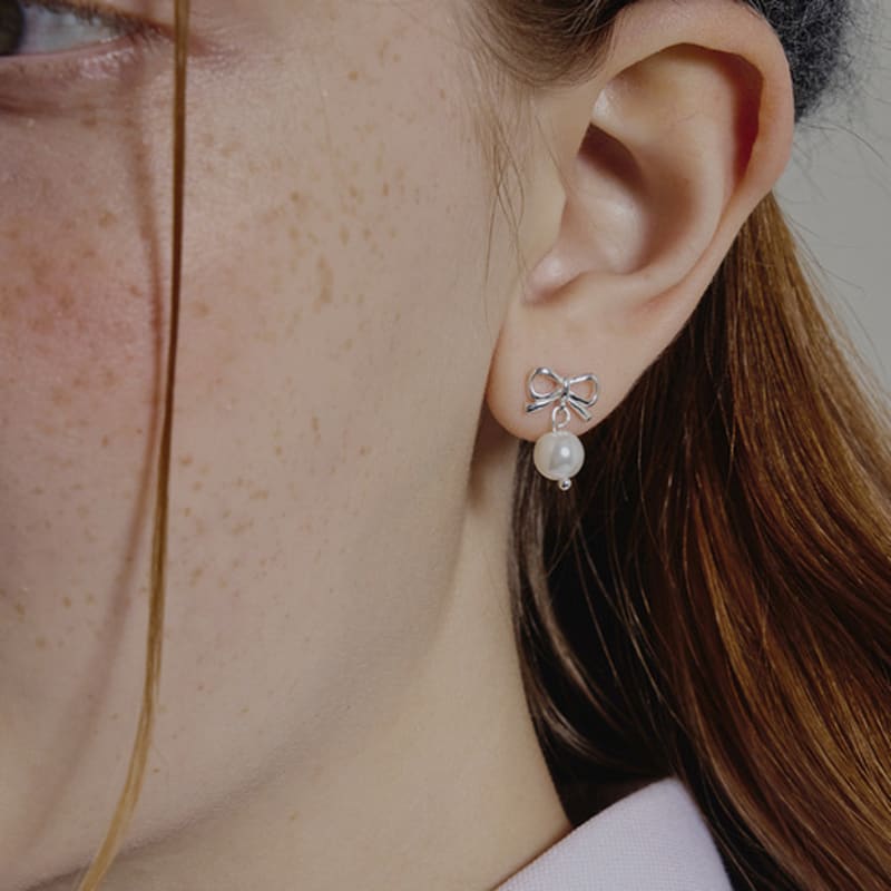 eenie beenie silver ribbon pearl drop earrings