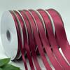 Лента из полиэстера винно-красного цвета шириной 0,6–5 см для упаковки подарочных коробок, оформления цветов и выпечки.