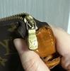 [Pre-Owned] Pochette Monogram Zip Closure PVC Handbag - Very Good #DU1QZB