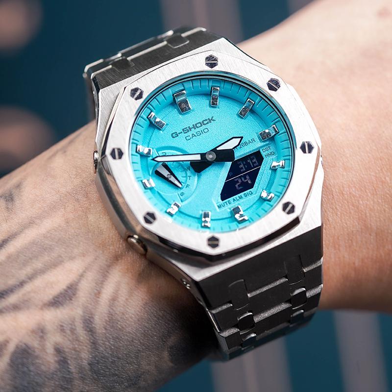 Casio Унисекс Серия с двойным жидкокристаллическим/аналоговым дисплеем Синие часы GA-2100SKE-7A