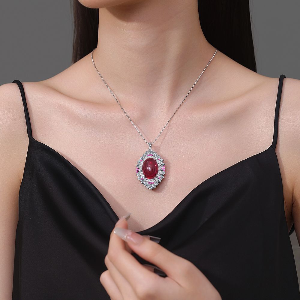 Retro Simulation Colored Treasure Egg-Shaped Hollow Red Steel Jade Inlaid Zircon Pendant