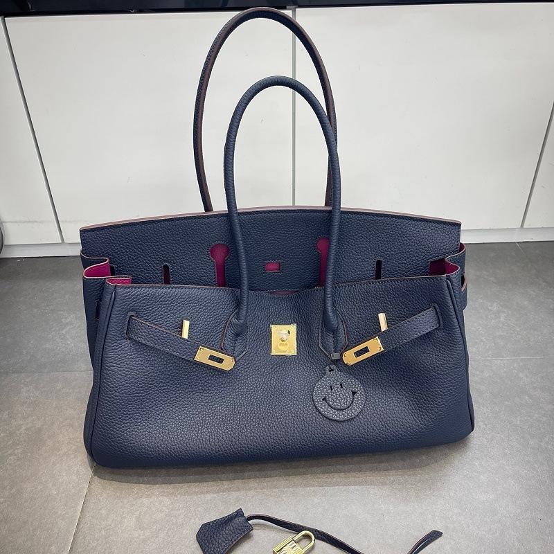 Cross-border trend bag short version oversized portable shoulder bag TOGO first layer cowhide large capacity giant pack