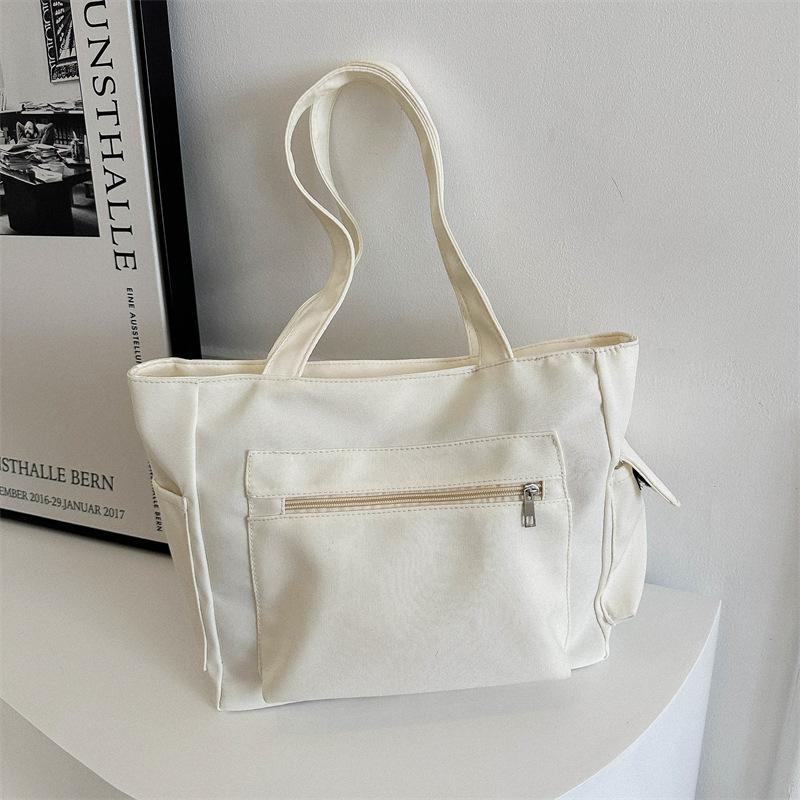 Корейская версия нишевого дизайна простая холщовая однотонная сумка женская сумка 2024 зимняя новая сумка большой вместимости через плечо подмышку