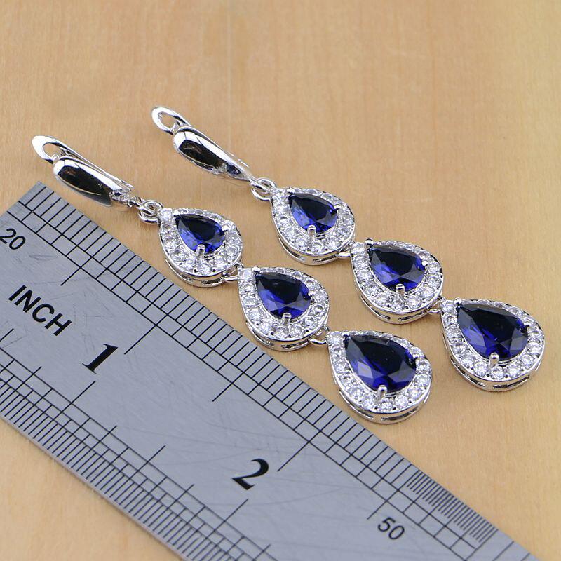 Набор ювелирных украшений под серебро с камнями синего цвета каплевидной формы по центру и мини стразами вокруг