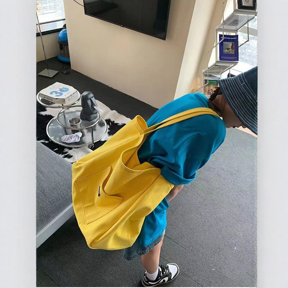 Нишевая однотонная холщовая сумка сумка 2025 новая корейская версия стиль ins сумка через плечо простая повседневная сумка-тоут большой вместимости