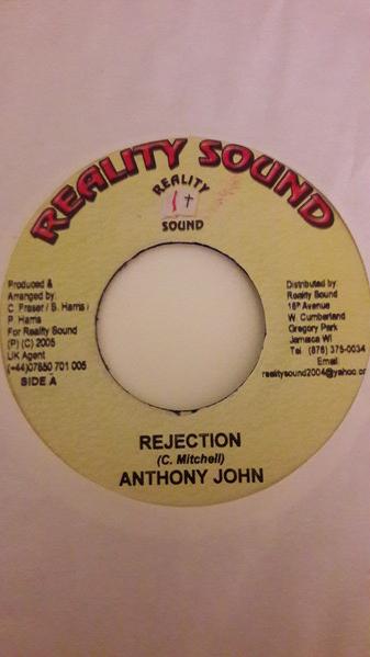 7-дюймовая пластинка ANTHONY JOHN - Rejection NONE Reality Sound 2005 Ямайка Регги, Ска и Даб Б/У