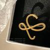 2024 High-end Retro Metal Letter Brooch: Elegant and Luxurious Niche Pin for Women