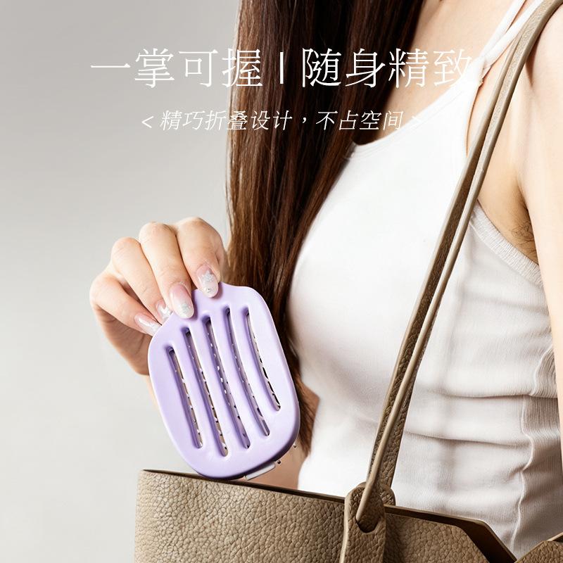 The new fluffy high cranial top comb comes with its own clean and removable massage airbag air cushion comb folding ribs comb.