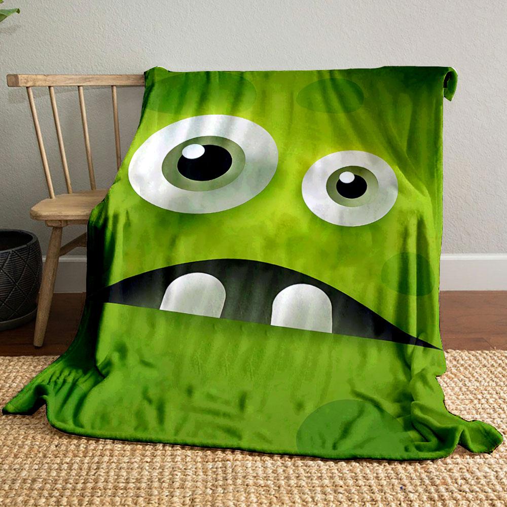 Large cartoon eyes, a dark mouth, teeth, and green textured background. for all seasons blanket lunch break throw gift