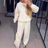 Женский повседневный комплект из двух предметов 2024 года: с круглым вырезом, длинным рукавом, деталями из горячих страз и манжетами на шнурке, идеально подходит для осени и зимы