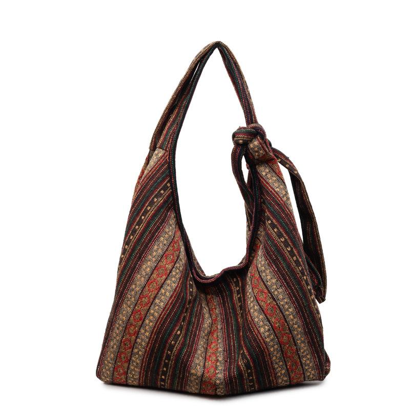 Модная и повседневная женская сумка большой вместимости для ношения под мышкой и через плечо.