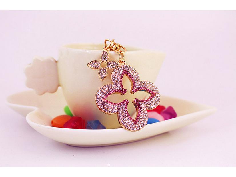 Exquisite Four-Leaf Clover Alloy Keychain Charm - Perfect Gift for Girlfriend, Bag Accent, or Keyring Accessory.