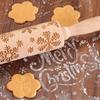 Wooden rolling pin with Christmas patterns and decorative engraving