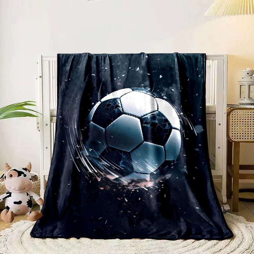 A soccer ball shattering dramatically with flying fragments and motion blur. for all seasons blanket lunch break throw gift