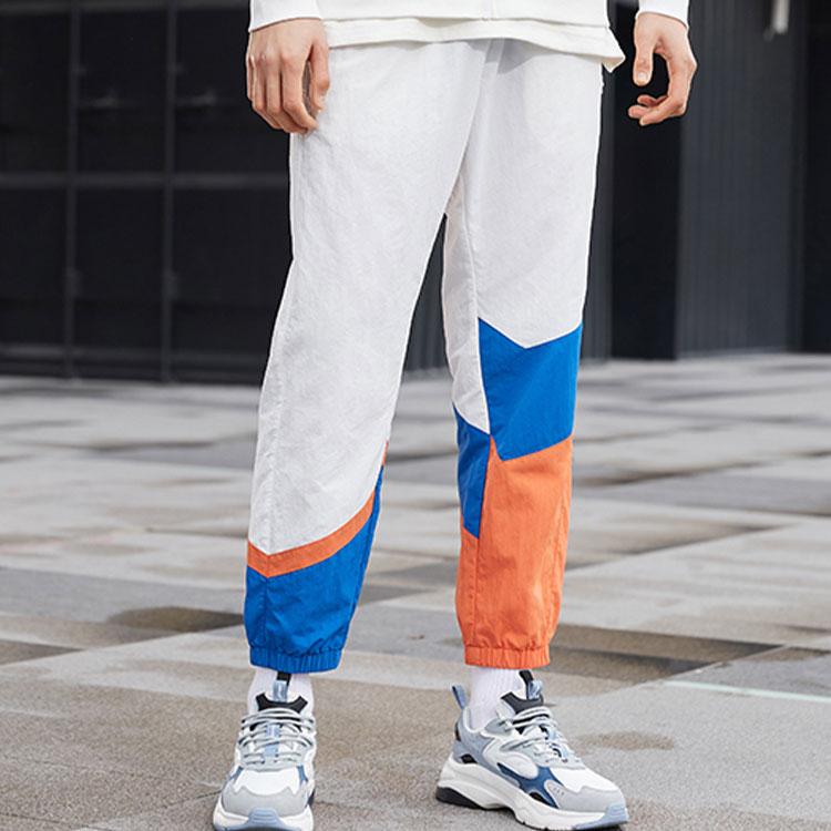 Li Ning Sports Fashion Series Logo Pattern Splicing Design Tapered Knit Pants Autumn Men Bottoms White AKXR421-3