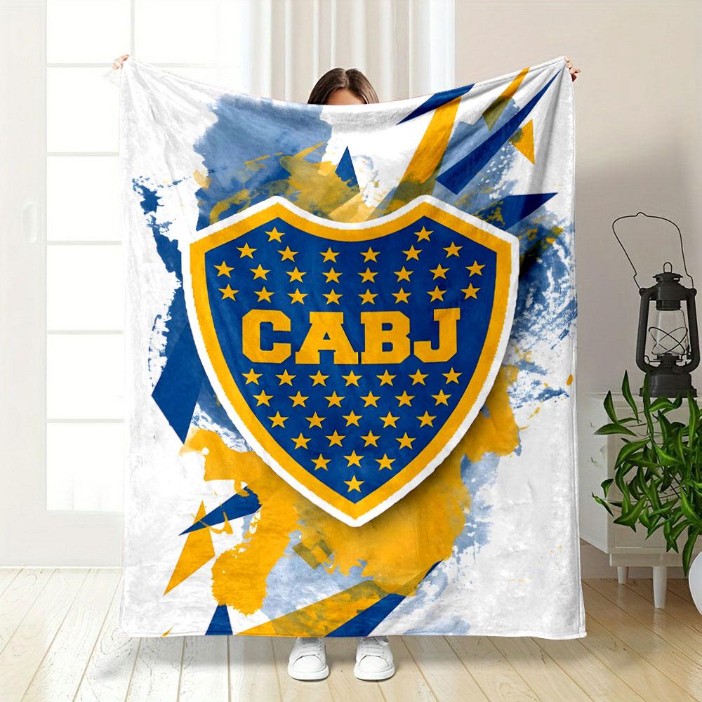 Blue and yellow shield with stars, splattered background, angular shapes. for all seasons blanket lunch break throw gift