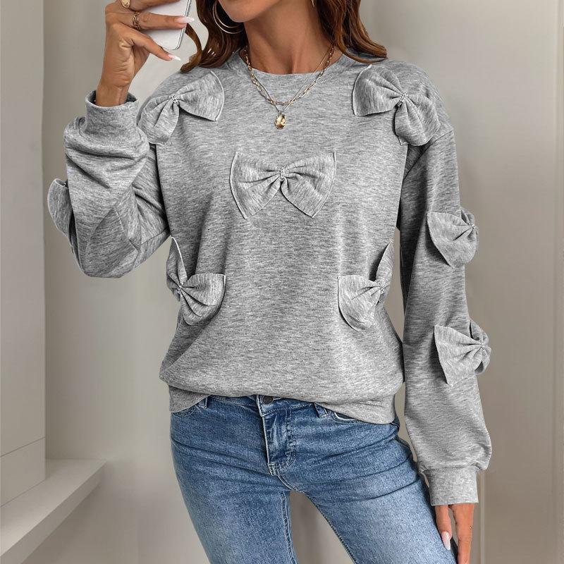 A Sweet and Casual Autumn Woman In A Grey Round-neck Hoodie with A Bow and A Unique Style